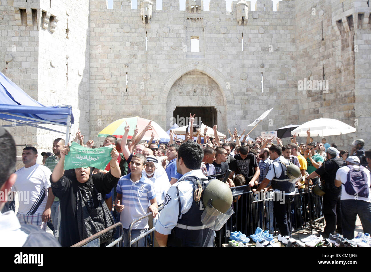 Sept. 14, 2012 - Jerusalem, Jerusalem, Palestinian Territory - Palestinians shout slogans during a demonstration against the controversial film 'Innocence of Muslims' in front of al-Aqsa Mosqe in Jerusalem, on September 14, 2012. The controversial low budget film reportedly made by an Israeli-American which portrays Muslims as immoral and gratuitous, sparked fury in Libya, where four Americans including the ambassador were killed on Tuesday when a mob attacked the US consulate in Benghazi, and has led to protests outside US missions in Morocco, Sudan, Egypt, Tunisia and Yemen  (Credit Image: © Stock Photo