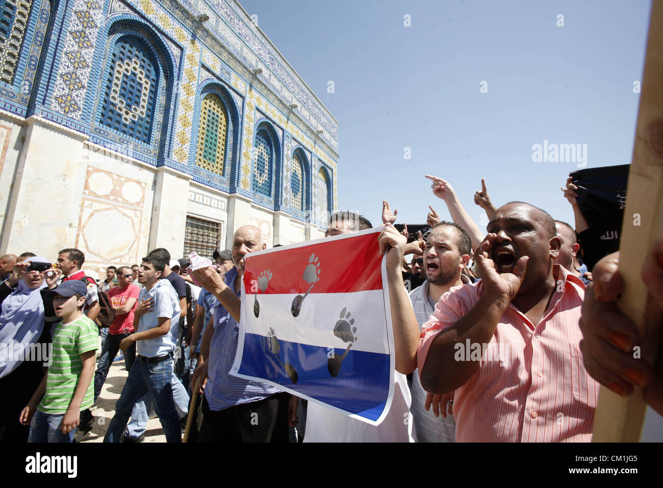 Sept. 14, 2012 - Jerusalem, Jerusalem, Palestinian Territory - Palestinians shout slogans during a demonstration against the controversial film 'Innocence of Muslims' in front of al-Aqsa Mosqe in Jerusalem, on September 14, 2012. The controversial low budget film reportedly made by an Israeli-American which portrays Muslims as immoral and gratuitous, sparked fury in Libya, where four Americans including the ambassador were killed on Tuesday when a mob attacked the US consulate in Benghazi, and has led to protests outside US missions in Morocco, Sudan, Egypt, Tunisia and Yemen  (Credit Image: © Stock Photo