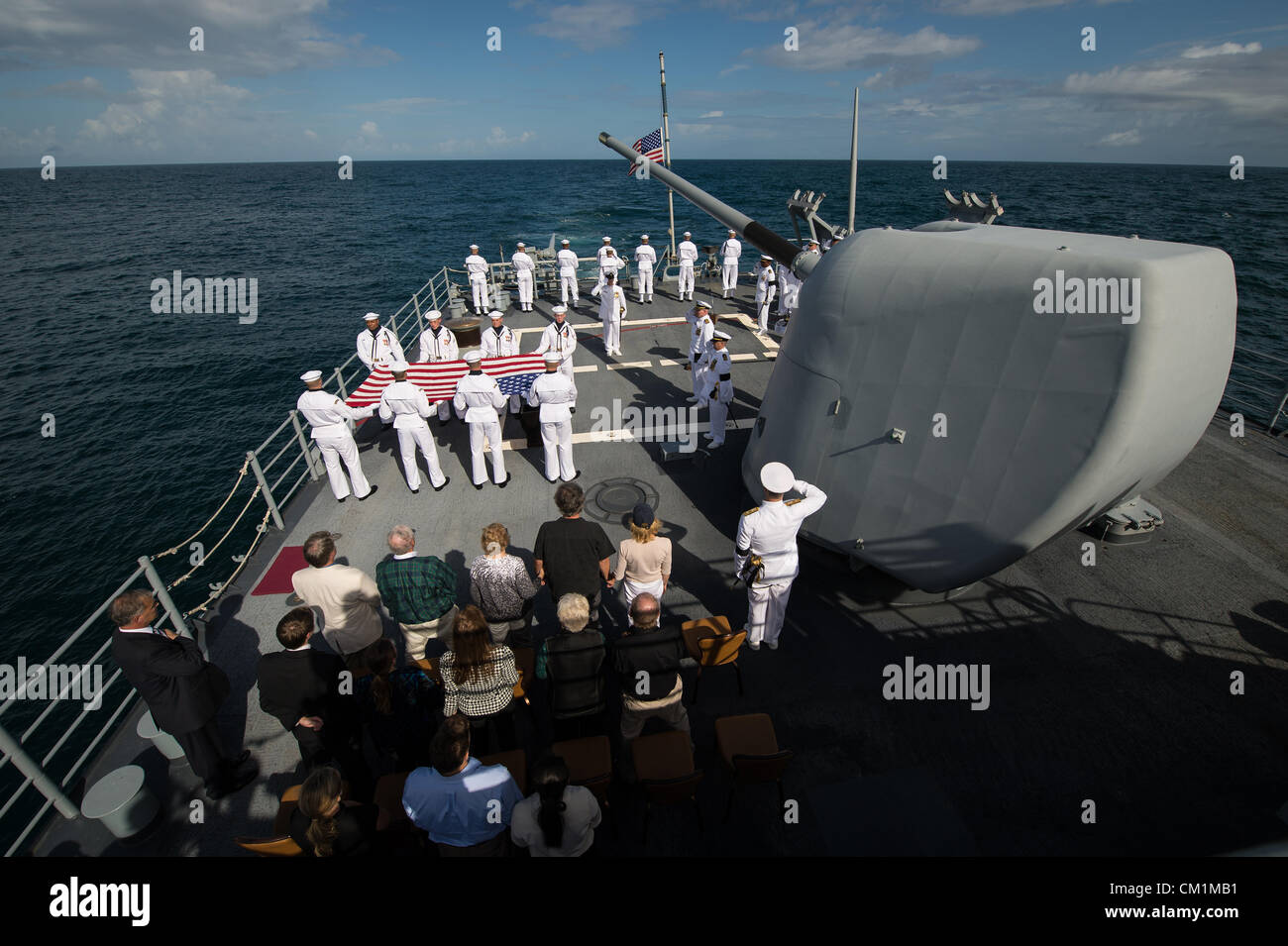 Family members of the late Neil Armstrong and members of the US Navy are seen during the burial at sea service for her husband Apollo 11 astronaut Neil Armstrong September 14, 2012 aboard the USS Philippine Sea in the Atlantic Ocean. Armstrong, the first man to walk on the moon during the 1969 Apollo 11 mission, died August 25. He was 82. Stock Photo