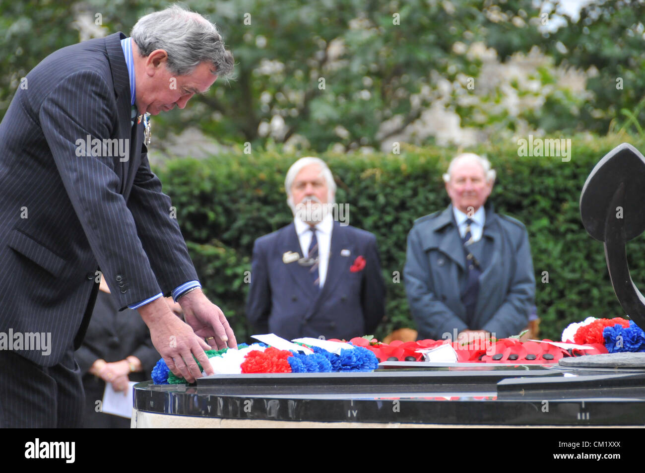 Trinity Square Gardens, London, UK. 16th September 2012. Laying a wreath at the monument. The Merchant Navy Day Commemorative Service takes place in Trinity Square Gardens. The annual service is held on the sunday in September closest to the Merchant Navy Day, 3rd September, this is held in memory of Merchant Seafarers who died in WW1 and WW2 and in conflicts today., Stock Photo