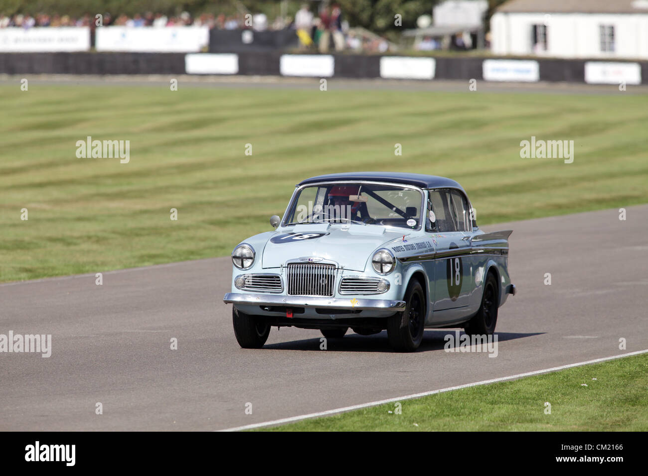 Goodwood Estate, Chichester, UK. 15th September 2012. Martin Donnelly driving a Sunbeam Rapier during the St Mary's Trophy at the Goodwood Revival. The revival is a 'magical step back in time', showcasing a mixture of cars and aviation from the 40's, 50's and 60's and is one of the most popular historical motor racing events in the world. For more information visit www.goodwood.co.uk/revival. Stock Photo