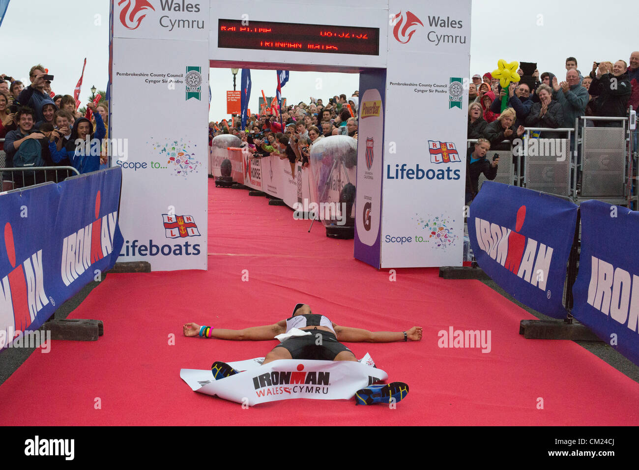 Exhausted Athlete "Sylvain Rota" Winner running finishing line during