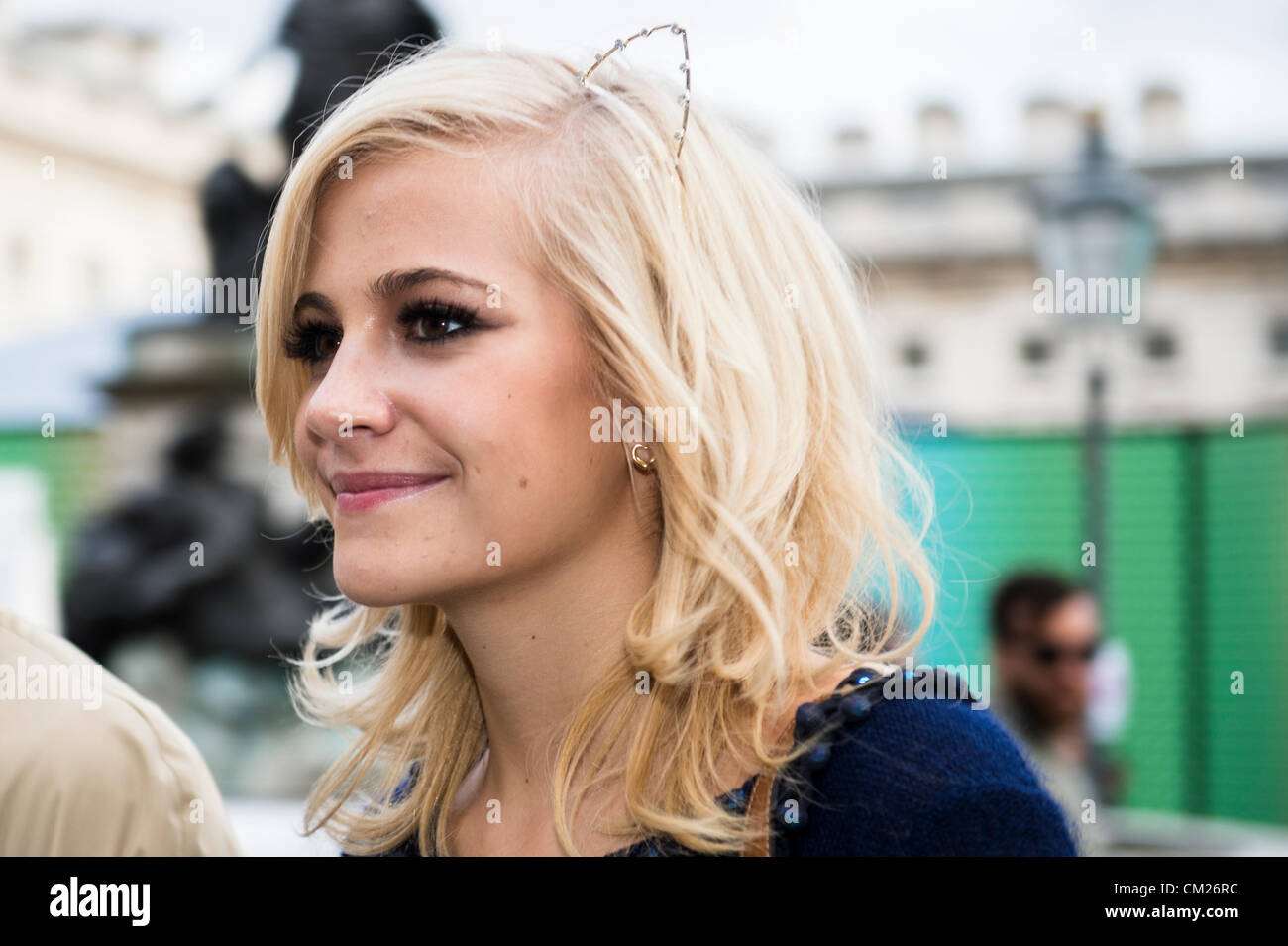 17th September 2012, UK. London Fashion Week at Somerset House, London. The famous and fashionable attend the shows or purely to hang out in the courtyard. Singer Pixie Lott smiles as she leaves the show. Stock Photo