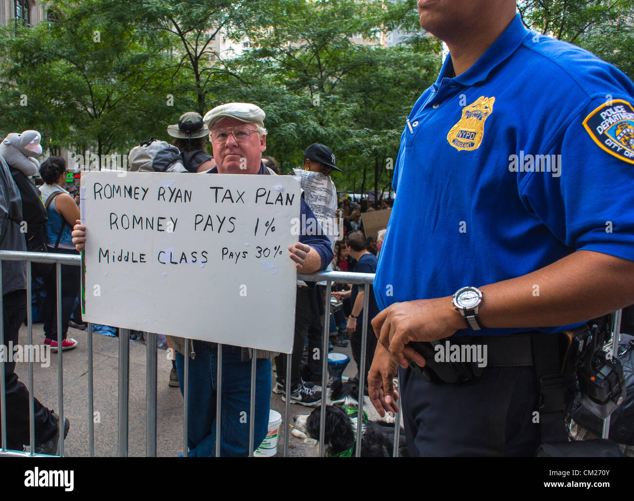 New York City, NY, USA, Protesters Holding Signs, Occupy Wall Street, near uniformed Policeman, social justice slogans Stock Photo