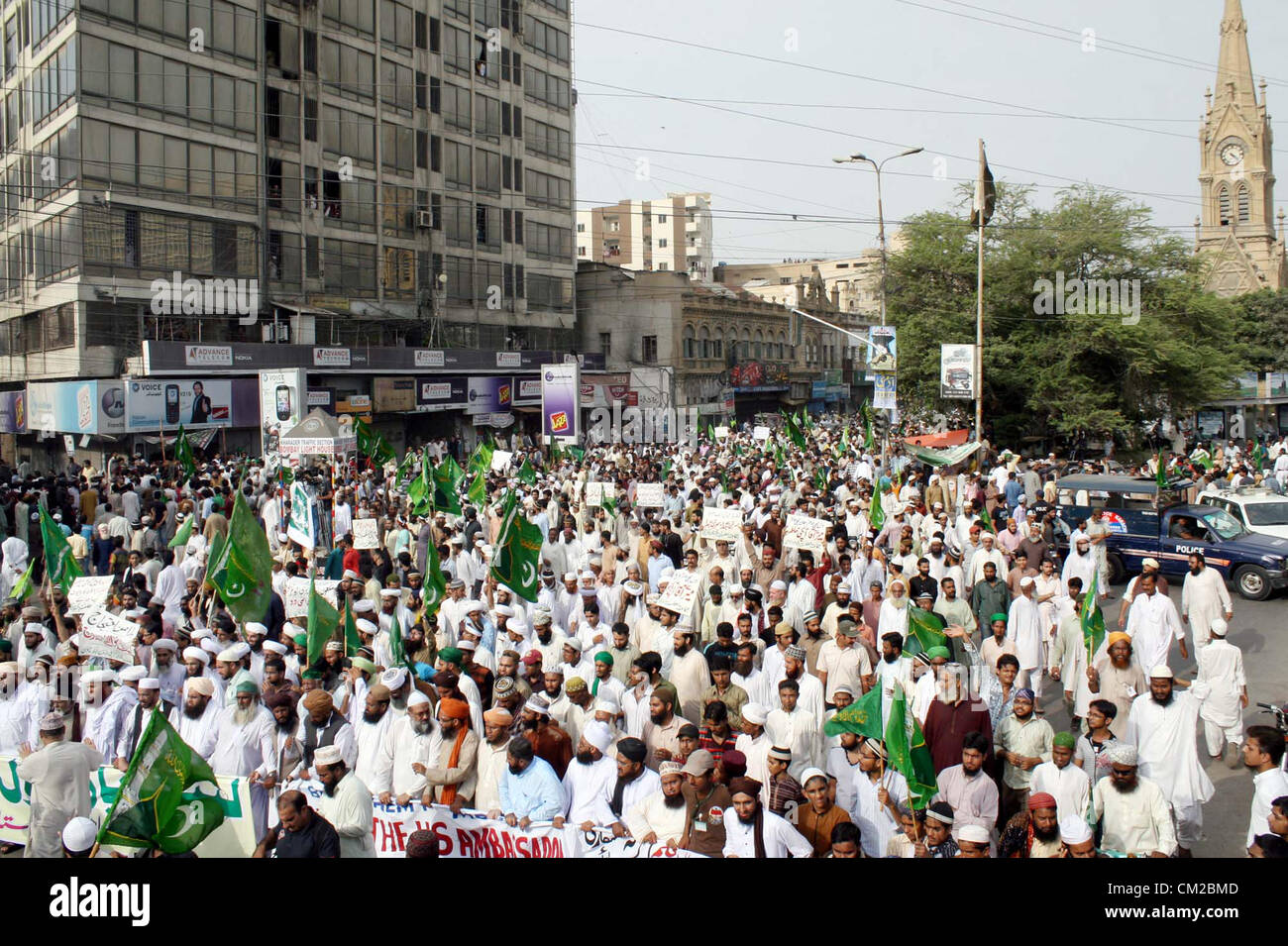 KARACHI, PAKISTAN, SEP 19: Activists of Jamat-e-Ahle Sunnat chant slogans against  blasphemy anti-Islamic movie released on the Internet by USA, during a protest rally at Tower in  Karachi on Wednesday, September 19, 2012. Protest against sacrilegious film continues in all  over Muslim World now a day. (S.Imran Ali/PPI Images). Stock Photo