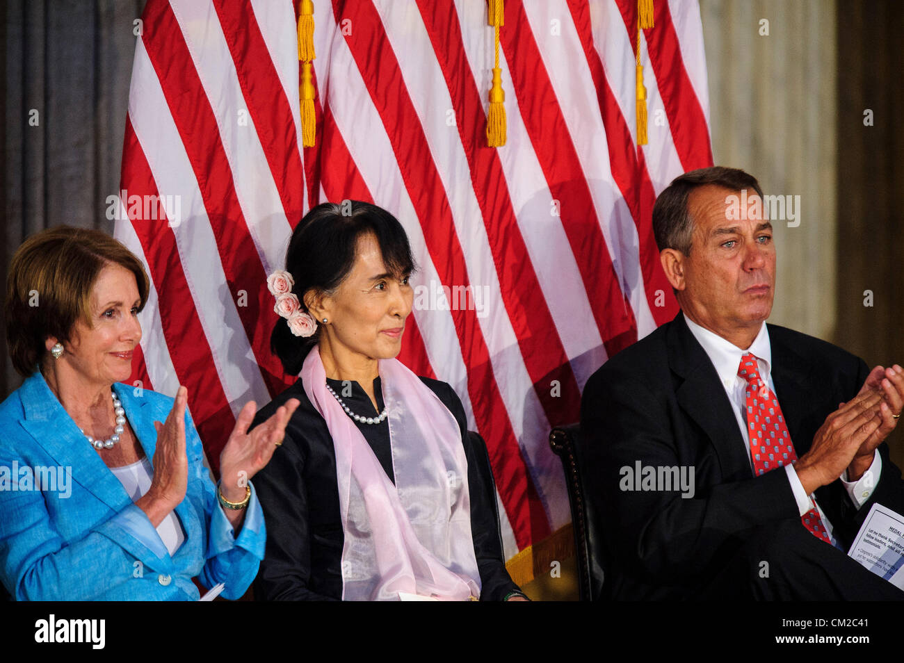 Sept. 19, 2012 - U.S. - House Minority Leader NANCY PELOSI (D-CA) and Speaker of the House JOHN BOEHNER (R-OH) sit with Burmese activist AUNG SAN SUU KYI at a ceremony on Capitol Hill where Members of Congress presented  the Congressional Gold Medal that she was awarded in absentia in 2008 when she was still under house arrest for opposing military rule in Myanmar now known as Burma. (Credit Image: © Pete Marovich/ZUMAPRESS.com) Stock Photo