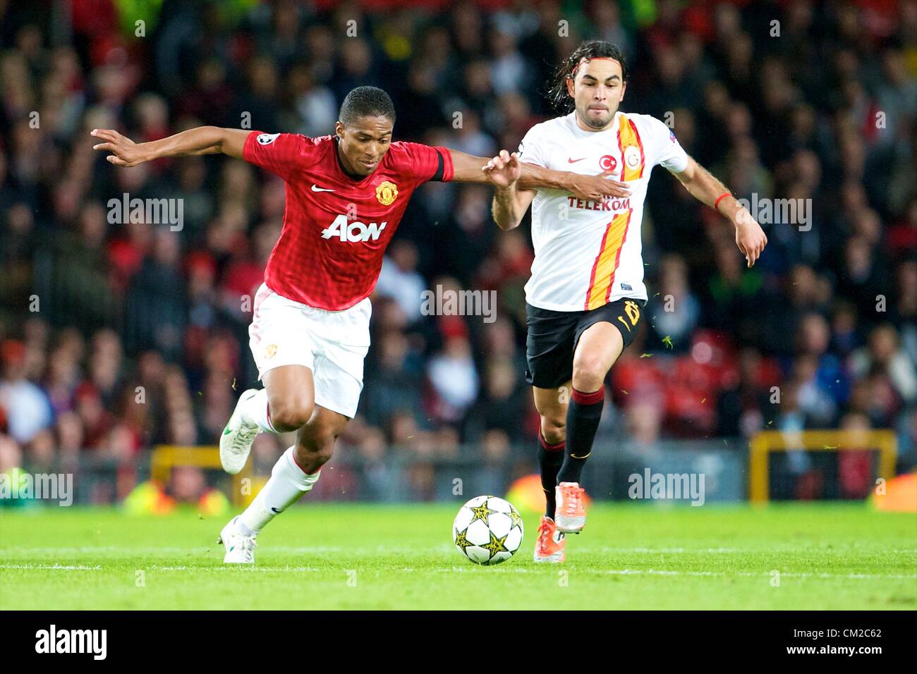 19.09.2012 Manchester, England. Manchester United's Ecuadorian midfielder Antonio Valencia and Galatasary's Turkish midfielder Sel&#xe7;uk &#x130;nan in action during the group H Champions League Football Manchester United v Galatasaray from Old Trafford. Man United ran out winners by Carricks only goal 1-0. Stock Photo