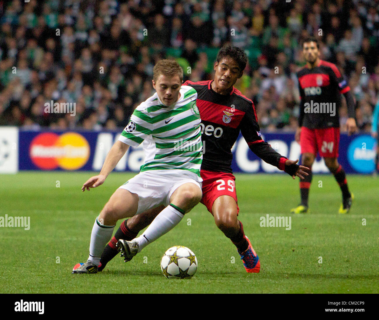 UEFA Champions League Football - Season 2012-13 Group G. Celtic FC v  Benfica FC. Celtic's James Forrest with Benfica's Melgarejo in action  during The UEFA Champions League Group G match between Celtic