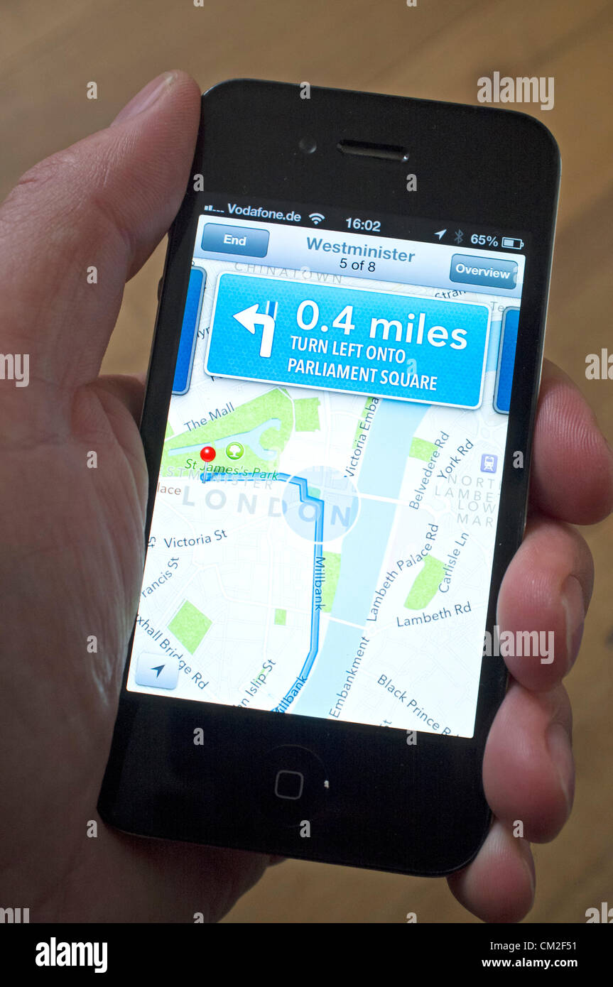 Car navigation with turn-by-turn directions on the new Apple Maps application.  Apple's new Maps application has been criticised by users for providing inaccurate locations of some destinations. The App was bundled with the new iOS6.0 operating system and replaces Google maps. Stock Photo
