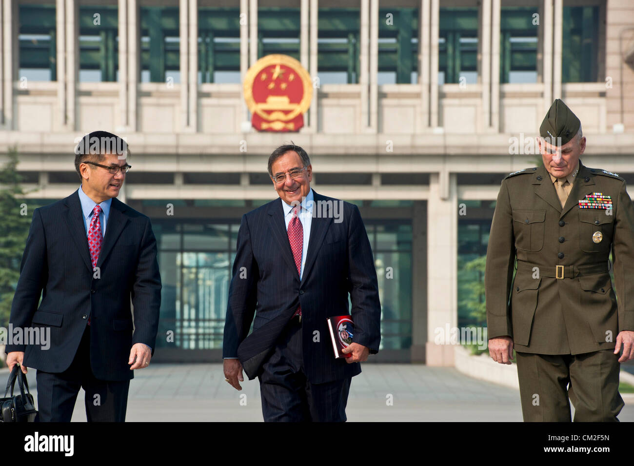 US Secretary of Defense Leon Panetta walks with U.S. Ambassador Gary Locke (left) and Marine Corps Lieutenant General John Kelly prior to departing September 20, 2012 in Beijing China . Panetta is on the first stop of a three nation tour to Japan, China and New Zealand. Stock Photo