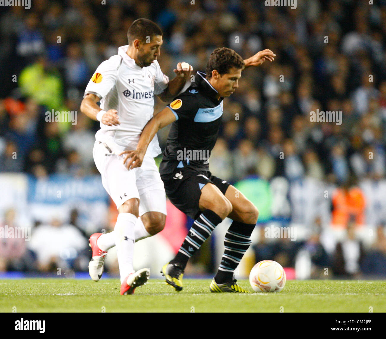 20.09.2012 London, ENGLAND:  Hernanes of S.S. Lazio and Clint Dempsey of Tottenham Hotspur in action during the Europa League Group J match between Tottenham Hotspur and SS Lazio at White Hart Lane Stadium Stock Photo