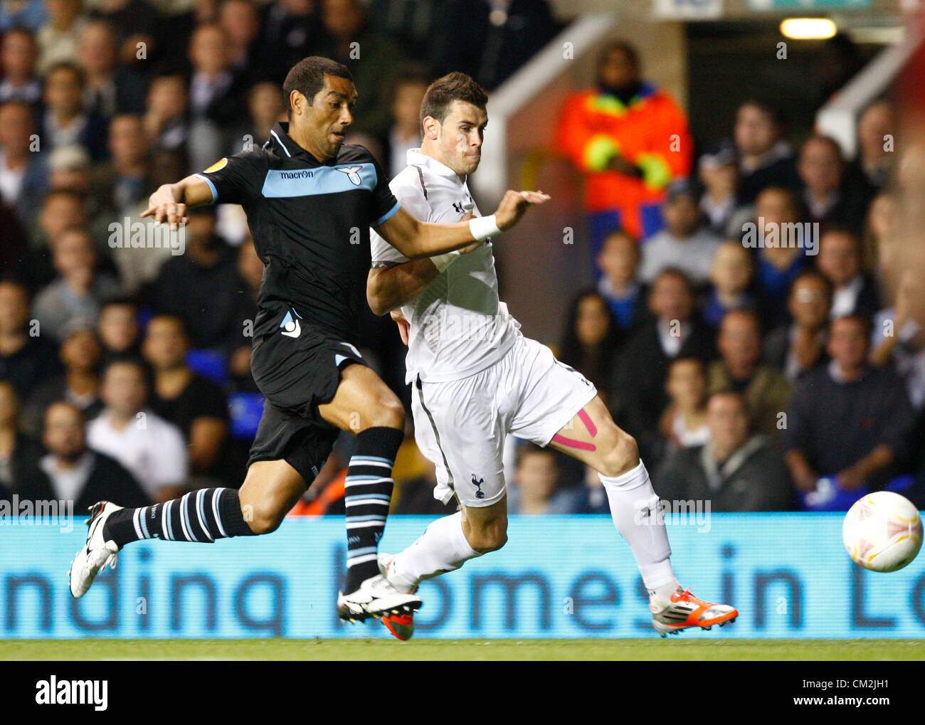20.09.2012 London, ENGLAND:  Gareth Bale of Tottenham Hotspur and Andre Dias of S.S. Lazio in action during the Europa League Group J match between Tottenham Hotspur and SS Lazio at White Hart Lane Stadium Stock Photo