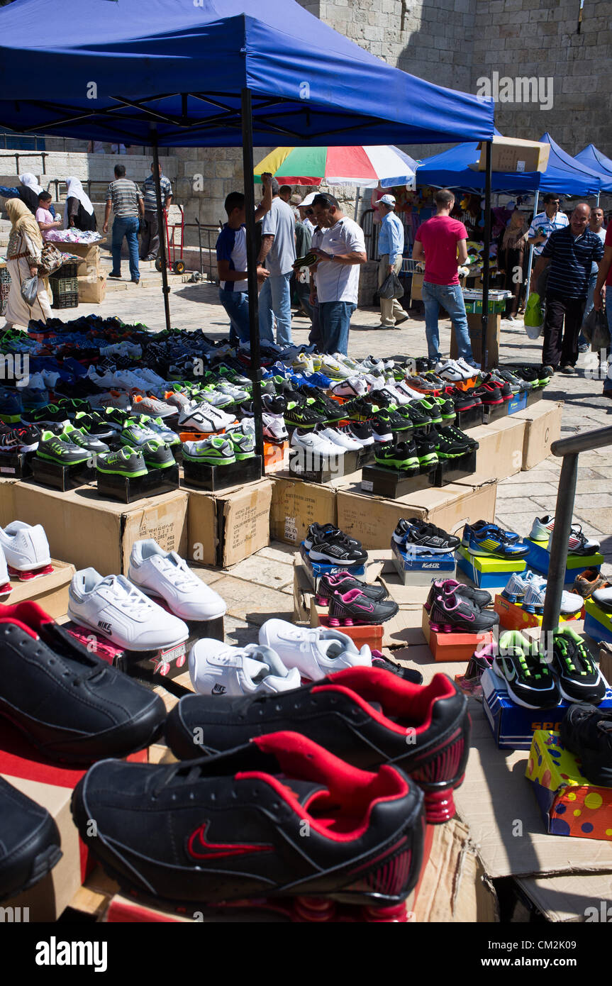 A shoe vendor displays his merchandise outside the Damascus Gate hoping for business from Friday