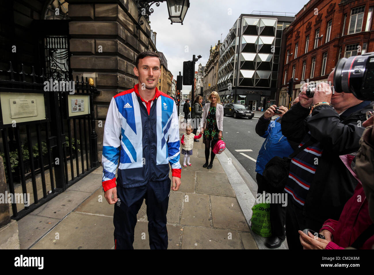 Liverpool, UK. 21st September, 2012. Taekwondo athlete Martin Stamper stops for photographs outside the Liverpool Town Hall. Olympians and Paralympians, who come from or trained in Liverpool, attend a reception at Liverpool's Town Hall on Friday, September 21, 2012 to honour their achievements at the London 2012 Summer Olympic and Paralympic Games. Stock Photo