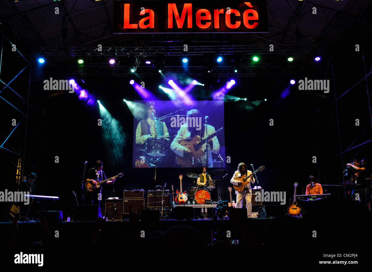 The 'Abbey Road', award winning Beatles tribute band, takes thousands of enthusiastic fans back to the 60s and 70s at Barcelona's city festival, La Merce, 2012. Stock Photo