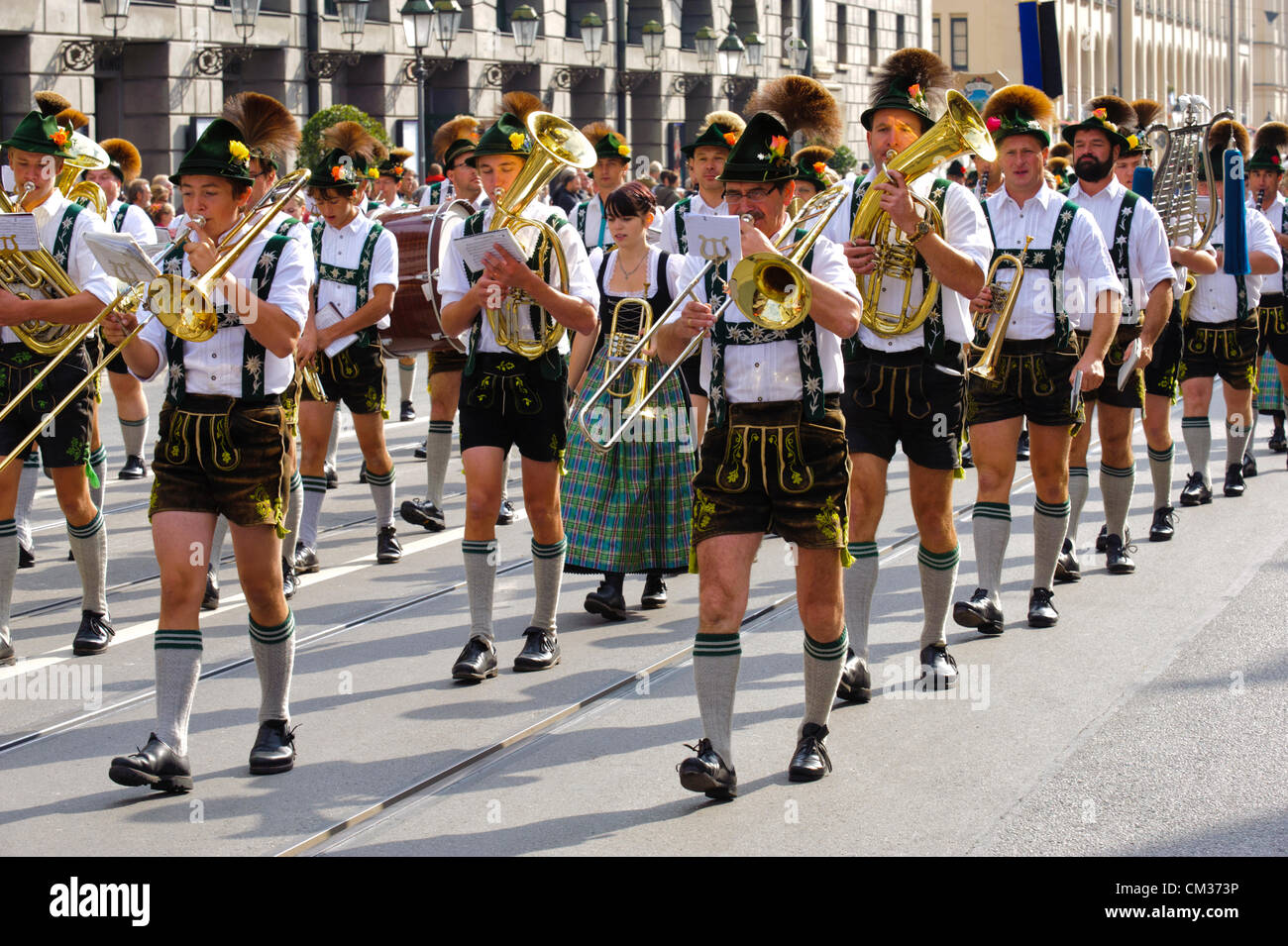 Munich, Germany. 23rd September, 2012. The opening parade of the world's biggest beer-festival, Oktoberfest, proceeds through the city of Munich, Germany. The music brass band of Burgberg, in traditional bavarian clothes, was part of 8900 participants of this public parade. Stock Photo