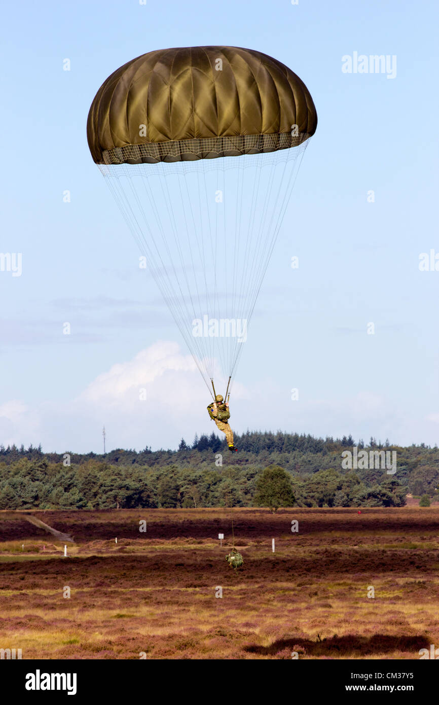 British paratrooper landing on the Ginkelse Heide after parachuted from an RAF Hercules during the Market Garden Memorial, Ginkelse Heide, The Netherlands, on Saturday September 22, 2012, 68 years after Operation Market Garden. Market Garden was a large Allied military operation in the same area during September 1944 Stock Photo