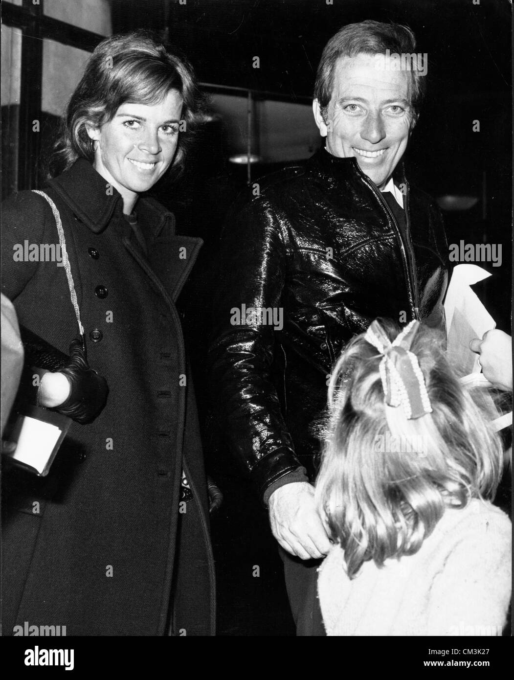 Nov. 8, 1970 - London, England, U.K. - Singer ANDY WILLIAMS and his estranged wife CLAUDINE LONGET arrived in London together for Williams to perform in the Royal Variety Performance at the London Palladium. PICTURED: Andy Williams and Claudine Longet stop to chat with little girl upon arriving at the Savoy Hotel. (Credit Image: © KEYSTONE Pictures USA/ZUMAPRESS.com) Stock Photo