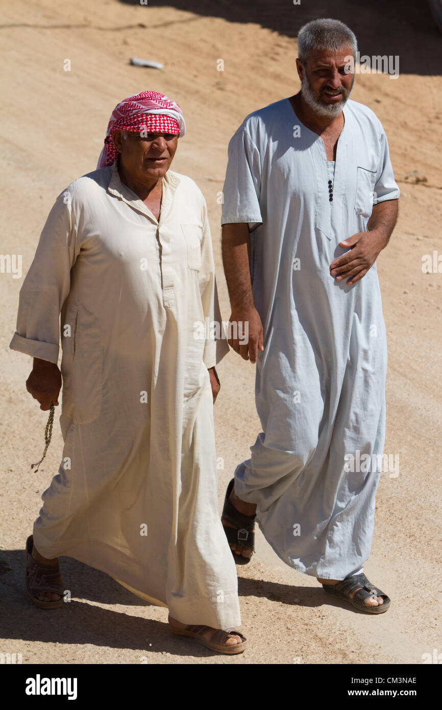 Syrians men walk in the street at the Zaatari Refugee Camp in Jordan on