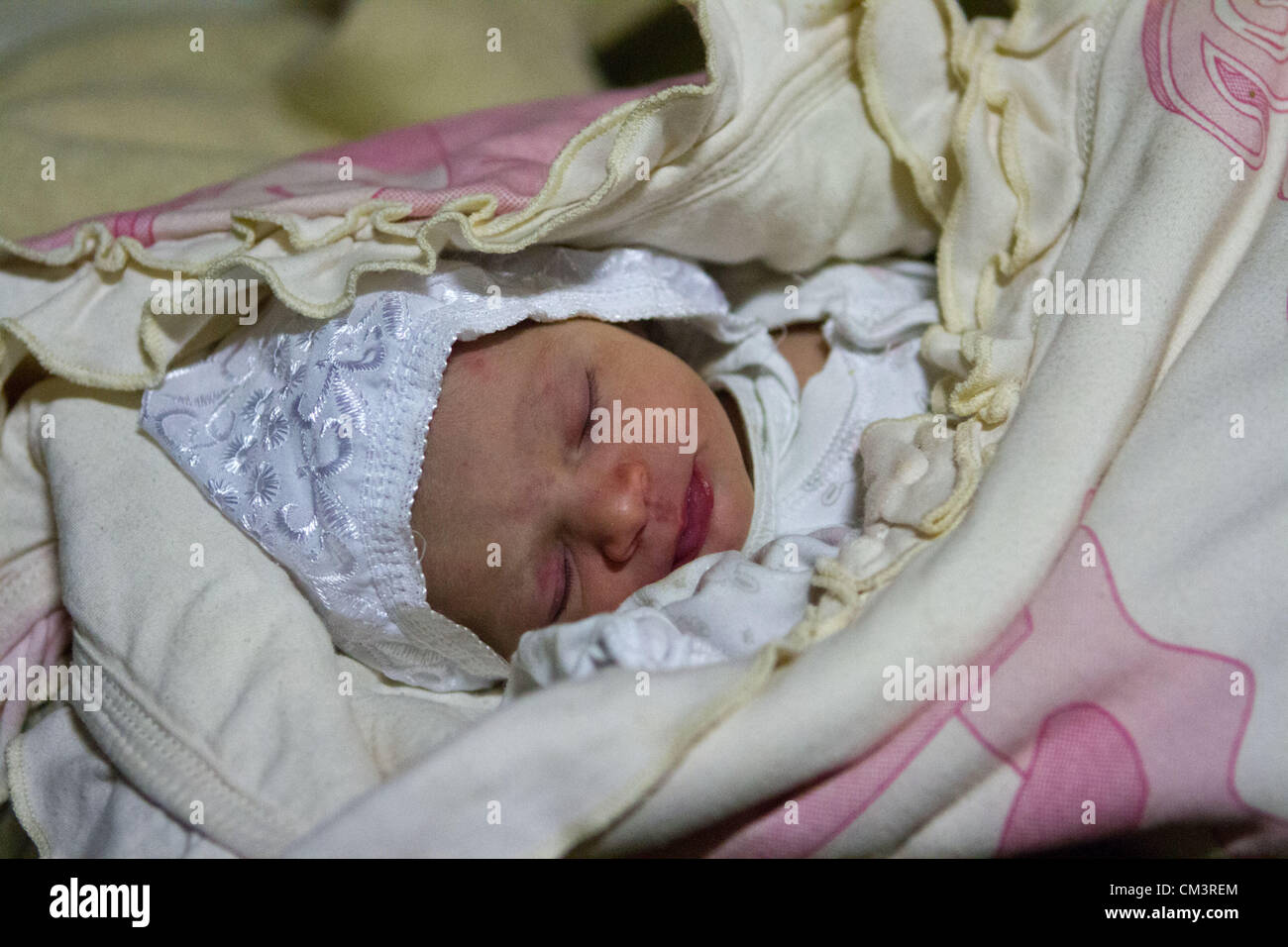 A one hour old baby girl called Cham rest in the Moroccan Medical and