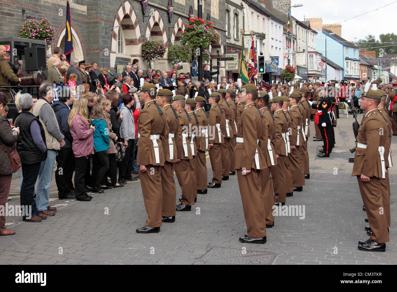 Cardigan, UK. 27th September, 2012. The Royal Welsh regiment exercising it's right to march in accordance with the freedom of the county of Ceredigion conferred upon it in 2009 on Thursday 27 September 2012.  Assembled outside Cardigan Guildhall. Stock Photo