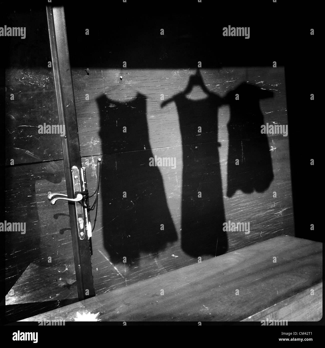 June 21, 2012 - Memphis, TN, U.S. - Shadows cast on The Neighborhood Market Place on Mississippi.  Owners Arvis and Sonja Latting describe their store as an inner city WalMart with the best prices in town for secondhand clothes, shoes, linens and electronics.   ..Chris Dean observes: ''In this area, there is a lot of prostitution. About four years ago a hooker got killed. This reminds me of the women that walked the streets. Many of them are pregnant. You shouldn't bring a kid into that situation. They can't afford not to. It's sad stuff. (Credit Image: © Alan Spearman/The Commercial Appeal/ZU Stock Photo