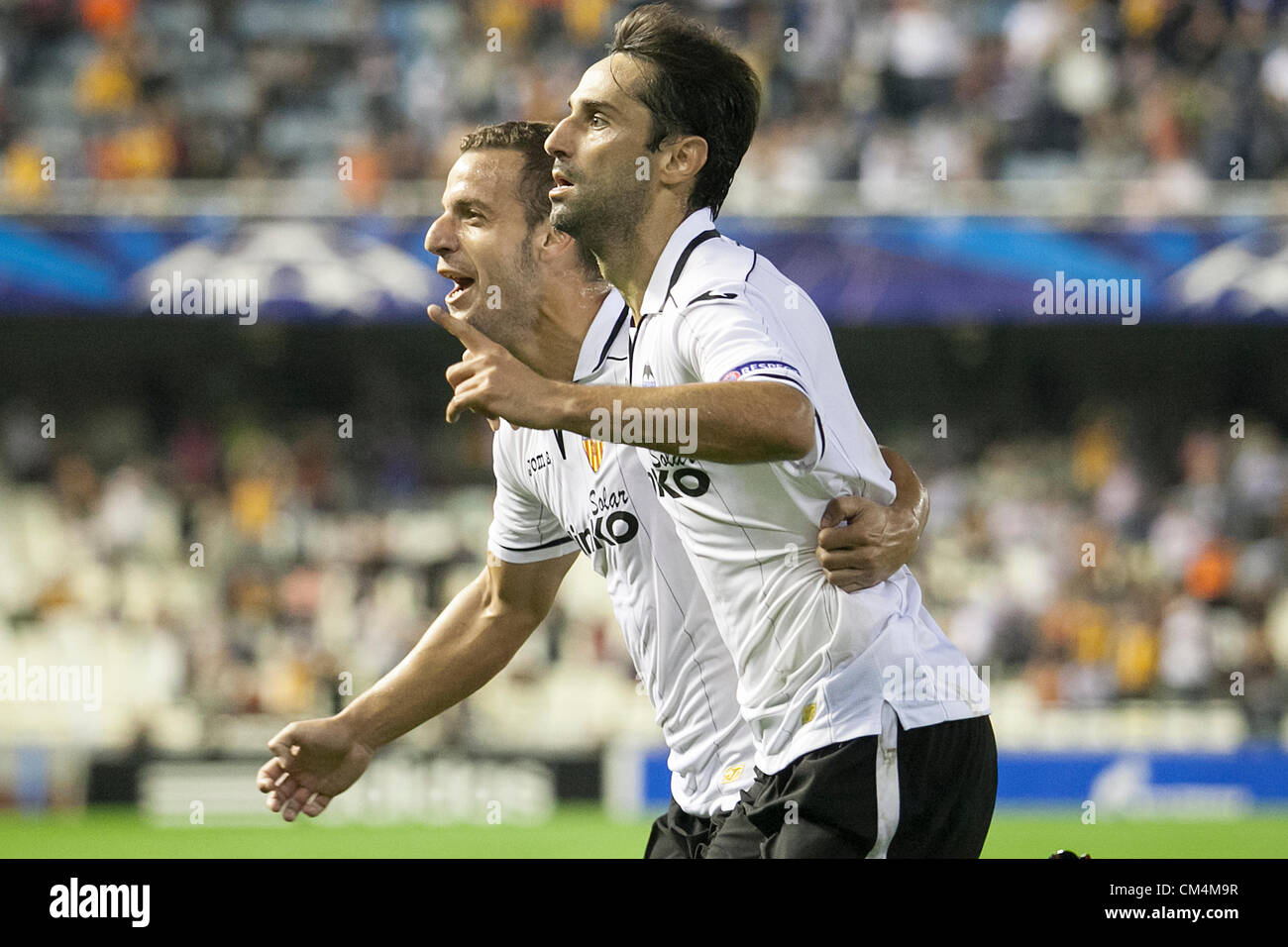 02.10.2012 Valencia, Spain. Jonas (R) of Valencia CF celebrates with Forward Roberto Soldado after scoring the first goal for his team, Jonas first Goal during the Champions League Group G game between Valencia   and Lille from Mestalla, Valencia, Spain. Stock Photo