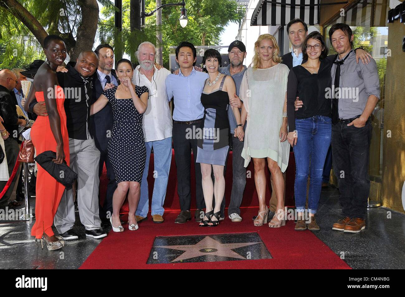 Danai Gurira, IronE Singleton, Sarah Wayne Callies, Scott Wilson, Steven Yeun, Gale Anne Hurd, Michael Rooker, Laurie Holden, Lauren Cohan, Norman Reedus at the induction ceremony for Star on the Hollywood Walk of Fame for Gale Ann Hurd, Hollywood Boulevard, Los Angeles, CA October 3, 2012. Photo By: Michael Germana/Everett Collection/ alamy live news. USA.  Stock Photo