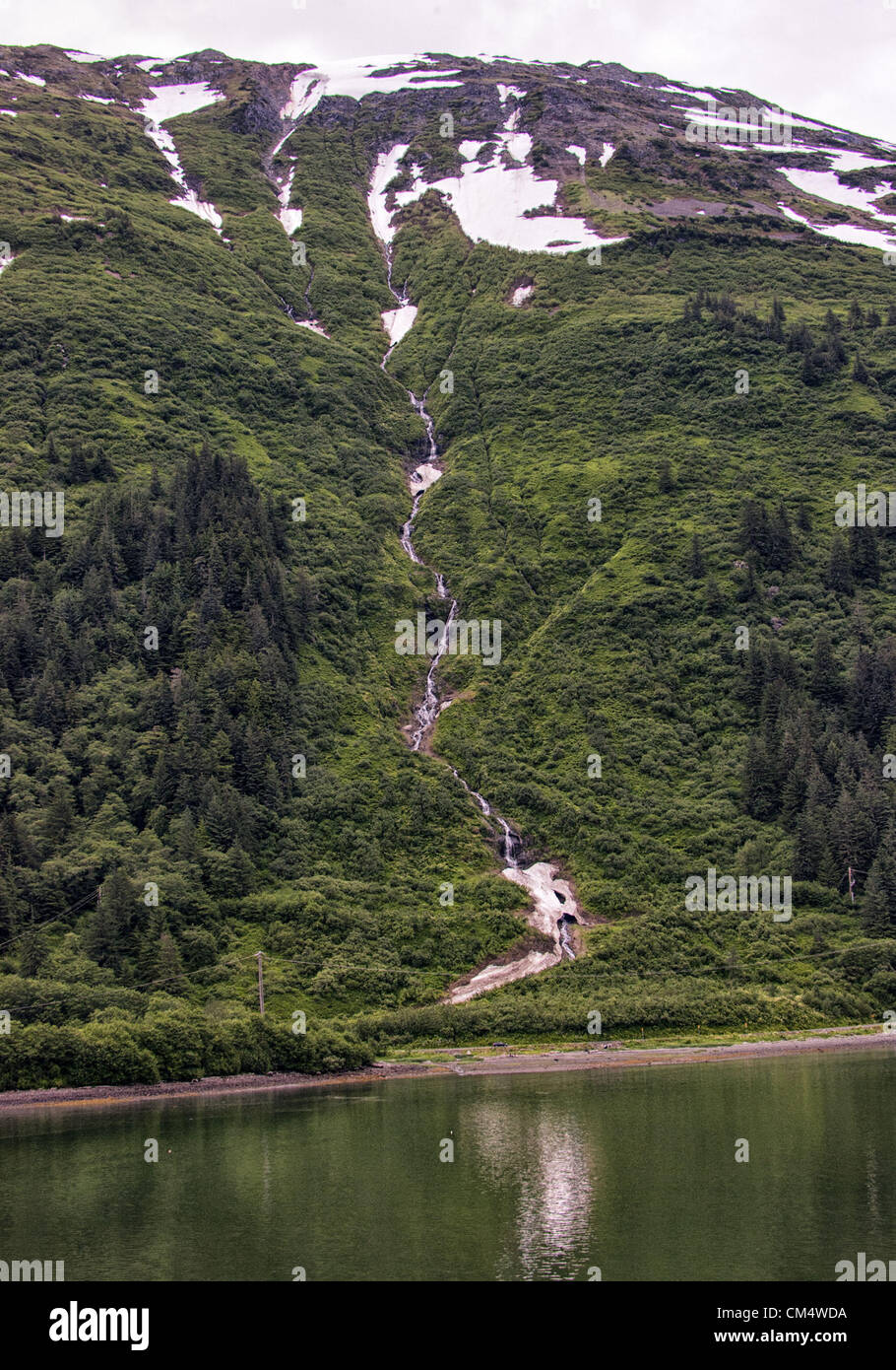 July 5, 2012 - Borough Of Juneau, Alaska, US - A stream fed by melting snow from one of the mountains in the Tongass National Forest flows into Gastineau Channel near Juneau. (Credit Image: © Arnold Drapkin/ZUMAPRESS.com) Stock Photo