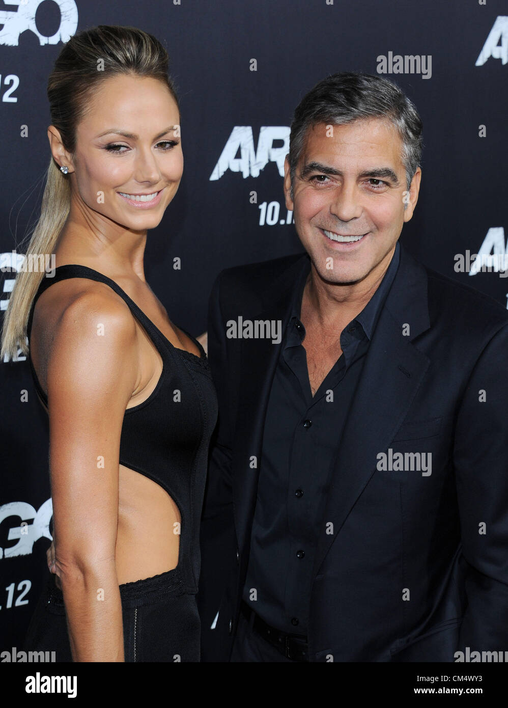 Stacy Keibler and George Clooney at the film premiere for 'Argo' in Beverly Hills, CA Oct 4th 2012. USA. Stock Photo