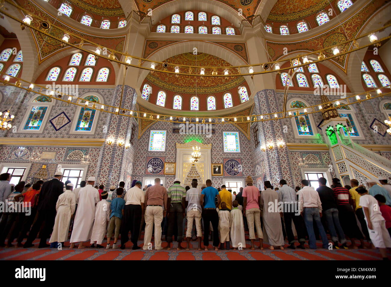 MIDRAND, SOUTH AFRICA: Men attend prayers at the Turkish Mosque in the Nizamiye Complex on October 4, 2012 in Midrand, South Africa. The Complex was officially opened by President Jacob Zuma and it contains the largest Turkish Mosque in the Southern Hemisphere. (Photo by Gallo Images / The Times / Daniel Born) Stock Photo