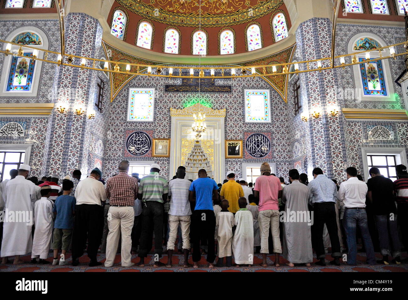 MIDRAND, SOUTH AFRICA: Men attend prayers at the Turkish Mosque in the Nizamiye Complex on October 4, 2012 in Midrand, South Africa. The Nizamiye Complex was officially opened by President Jacob Zuma and contains the largest Turkish in the Southern Hemisphere. (Photo by Gallo Images / City Press / Herman Verwey) Stock Photo