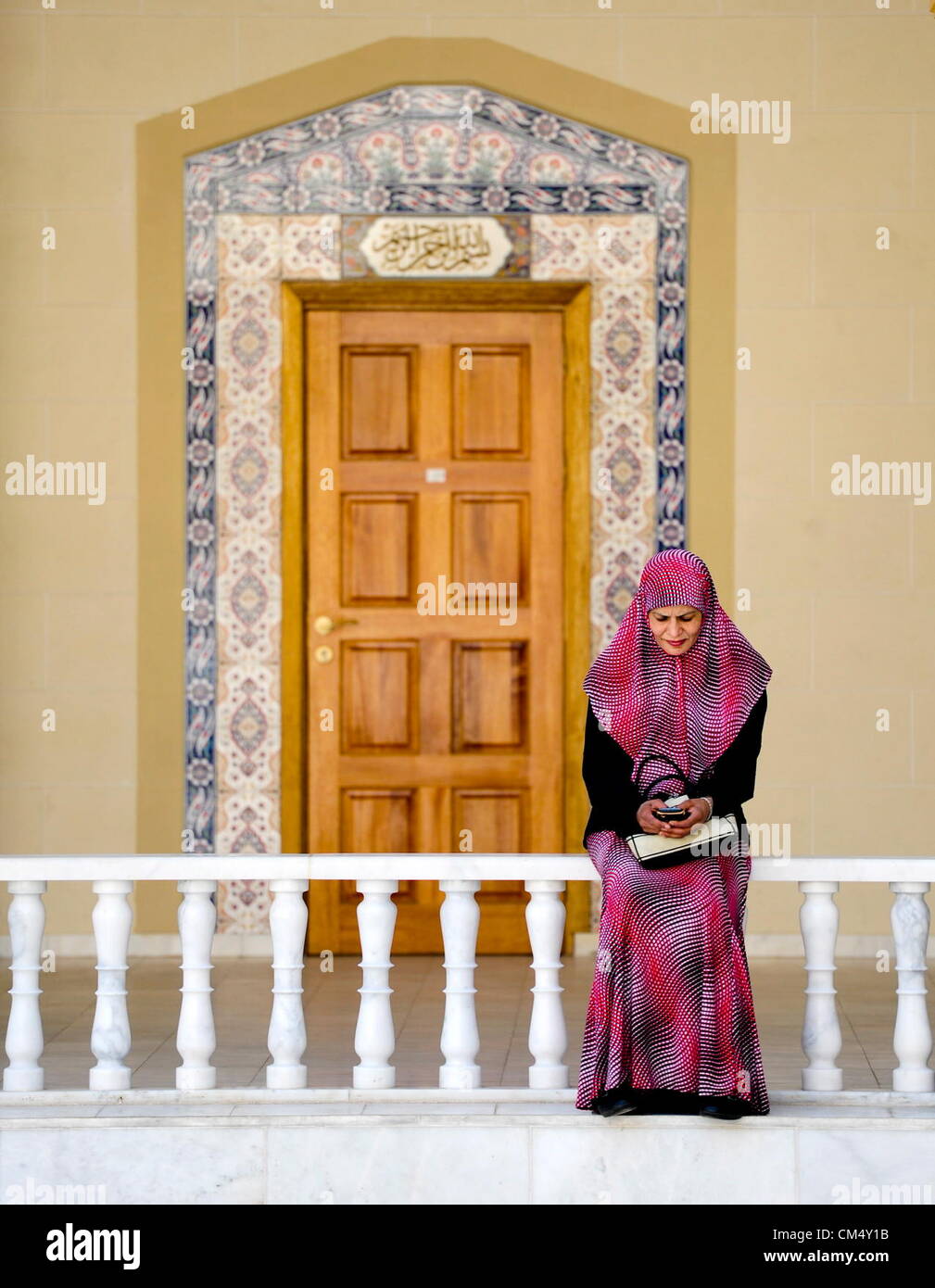 MIDRAND, SOUTH AFRICA: A woman sits outside the Mosque in the Nizamiye Complex on October 4, 2012 in Midrand, South Africa. The Nizamiye Complex was officially opened by President Jacob Zuma and contains the largest Turkish in the Southern Hemisphere. (Photo by Gallo Images / City Press / Herman Verwey) Stock Photo