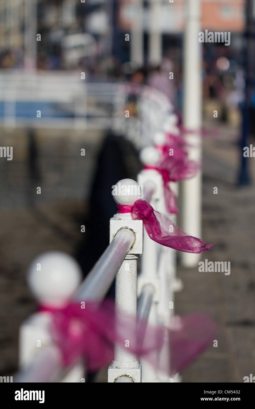 Aberystwyth, mid Wales, UK, 6 October 2012. Pink ribbons line the promenade at Aberystwyth, now in memory of April Jones, the little girl from Machynlleth. Mark Bridger was this afternoon charged with her abduction and murder. Stock Photo