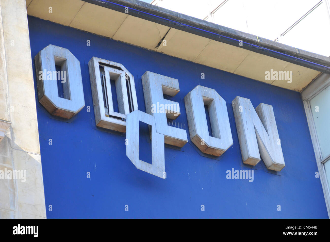 Charing Cross Road, London, UK. 6th October 2012. The metal coverings of the ODEON cinema on Charing Cross Road are removed by firemen after one of the signs nearly fell to the ground. Stock Photo