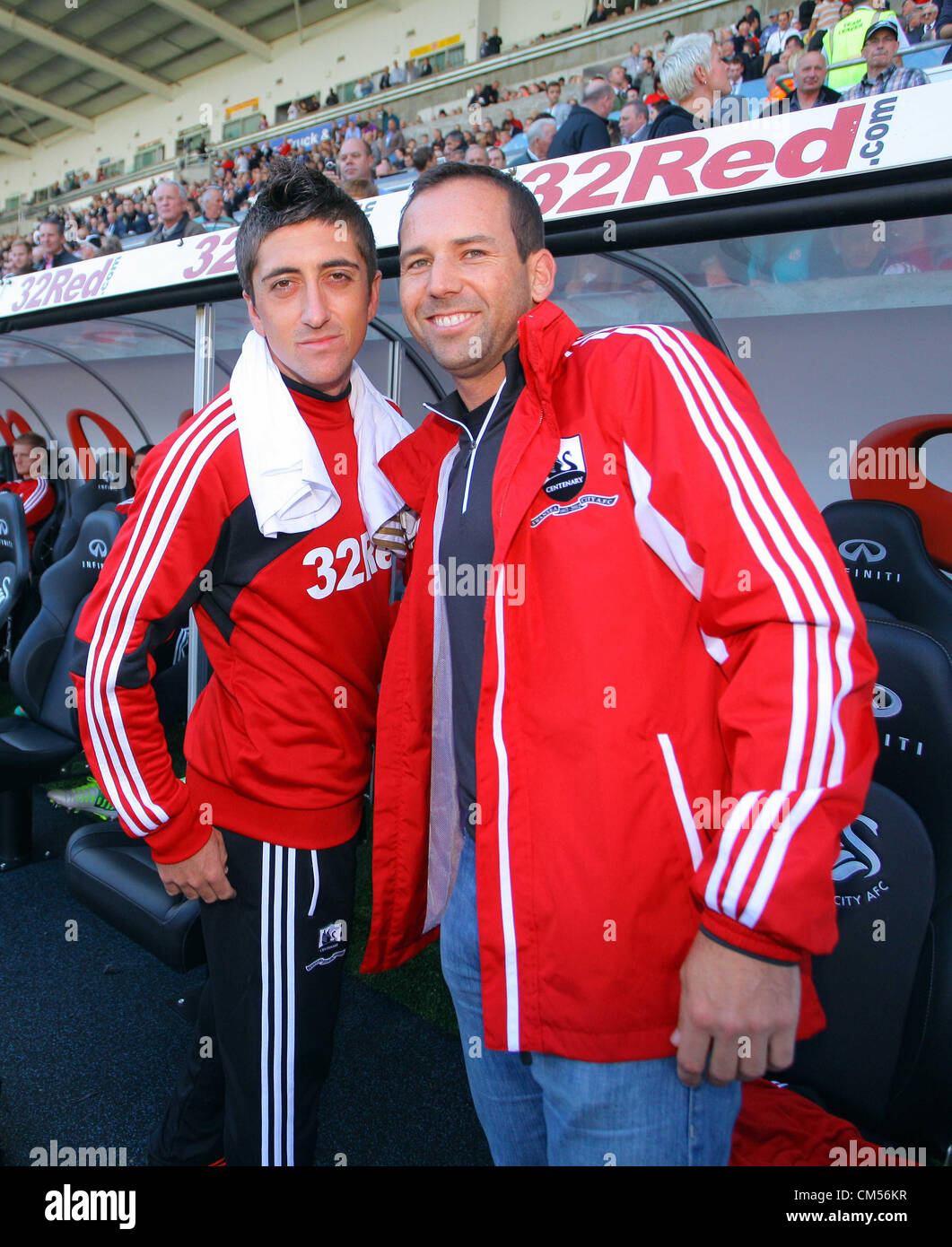 Saturday, 06 October 2012  Pictured: Spanish golfer Sergio Garcia (R) with Pablo Hernandez (L).  Re: Barclays Premier League, Swansea City FC v Reading at the Liberty Stadium, south Wales. Stock Photo