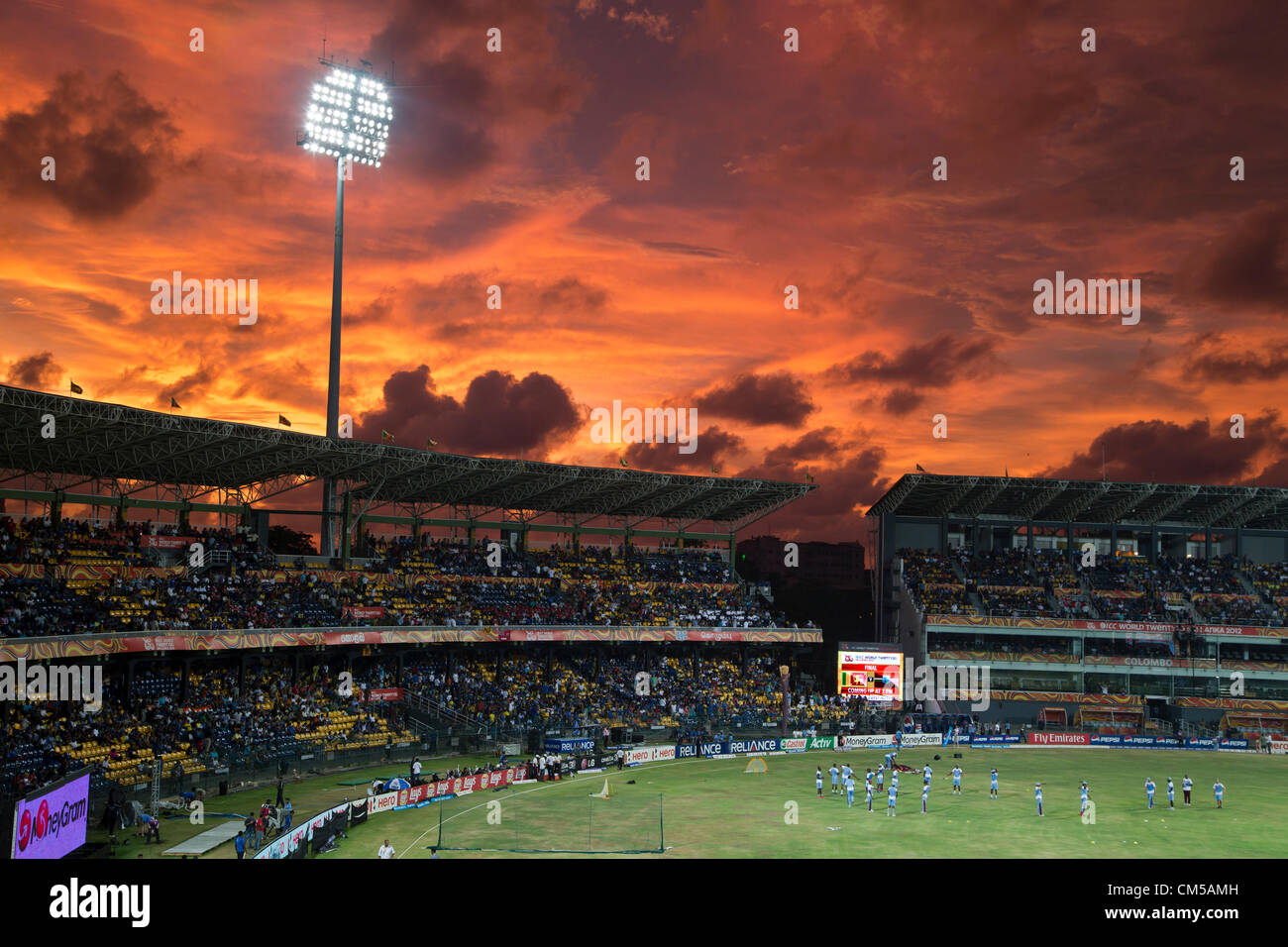 A fiery sky awaits the West Indians warming up before the start of the finals Stock Photo