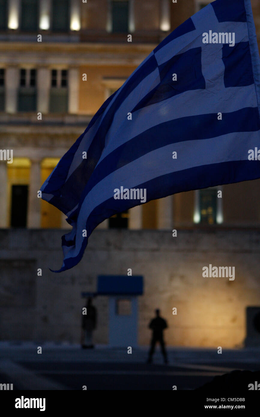 Oct. 8, 2012 - Athens, Greece - Anti-austerity protest outside the Greek parliament, a day before the visit by German Chancellor Angela Merkel. The authorities are keen to prevent embarrassing riots. More than 7,000 police will be on security duty in the capital from early Tuesday, while public gatherings will be banned in much of the city center and on a 100-meter (yard) radius from the route her motorcade will follow. The ban will not affect the main protests, but will prevent demonstrators from reaching the German embassy, where a populist right wing party was planning a protest. Stock Photo