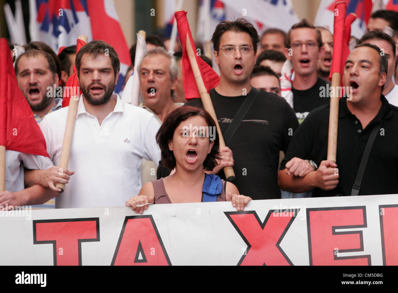 Oct. 8, 2012 - Athens, Greece - Anti-austerity protest outside the Greek parliament, a day before the visit by German Chancellor Angela Merkel. The authorities are keen to prevent embarrassing riots. More than 7,000 police will be on security duty in the capital from early Tuesday, while public gatherings will be banned in much of the city center and on a 100-meter (yard) radius from the route her motorcade will follow. The ban will not affect the main protests, but will prevent demonstrators from reaching the German embassy, where a populist right wing party was planning a protest. Stock Photo