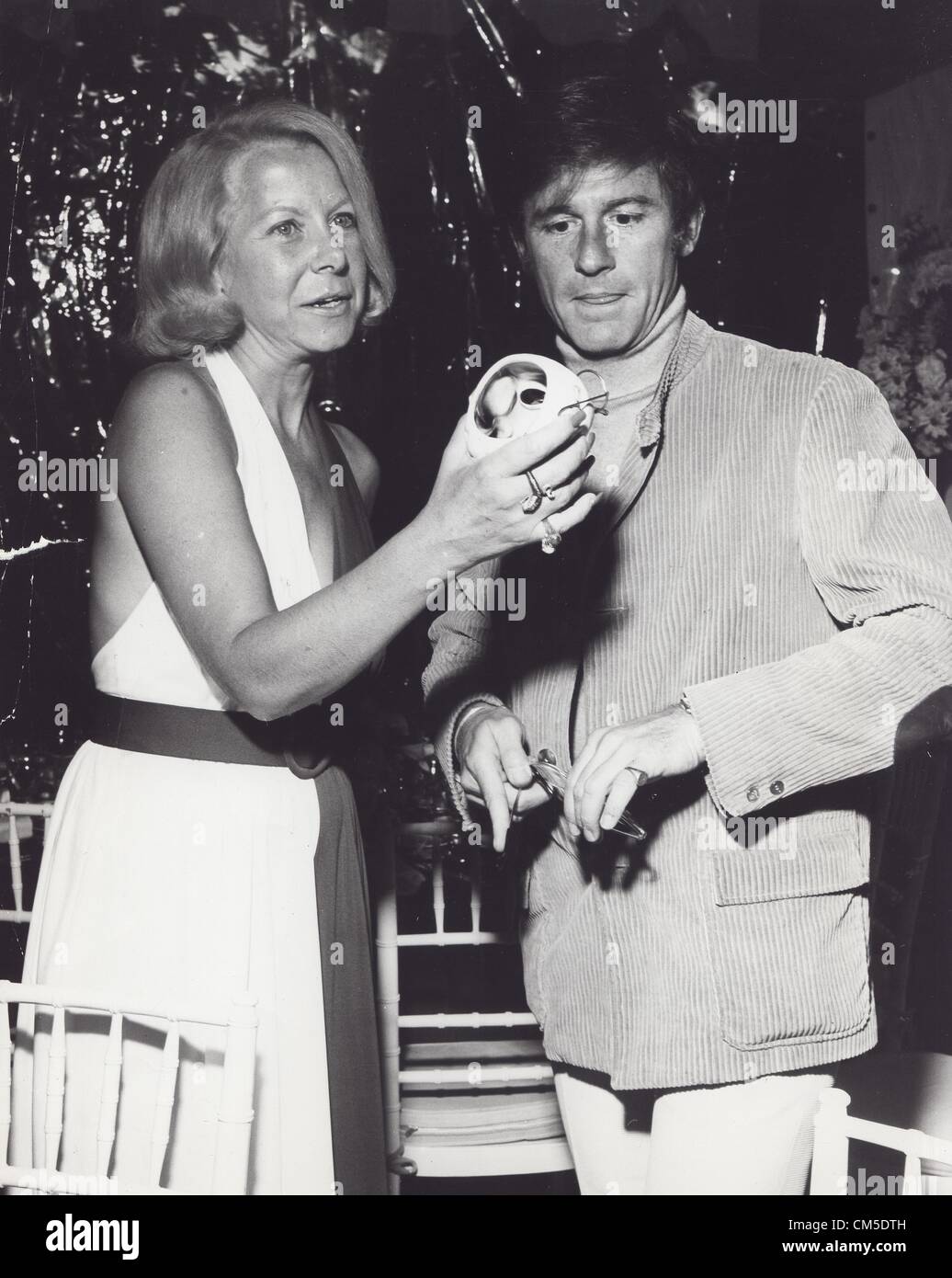 RODDY MCDOWALL with Joyce Haber at the premiere of The Legend of Hell