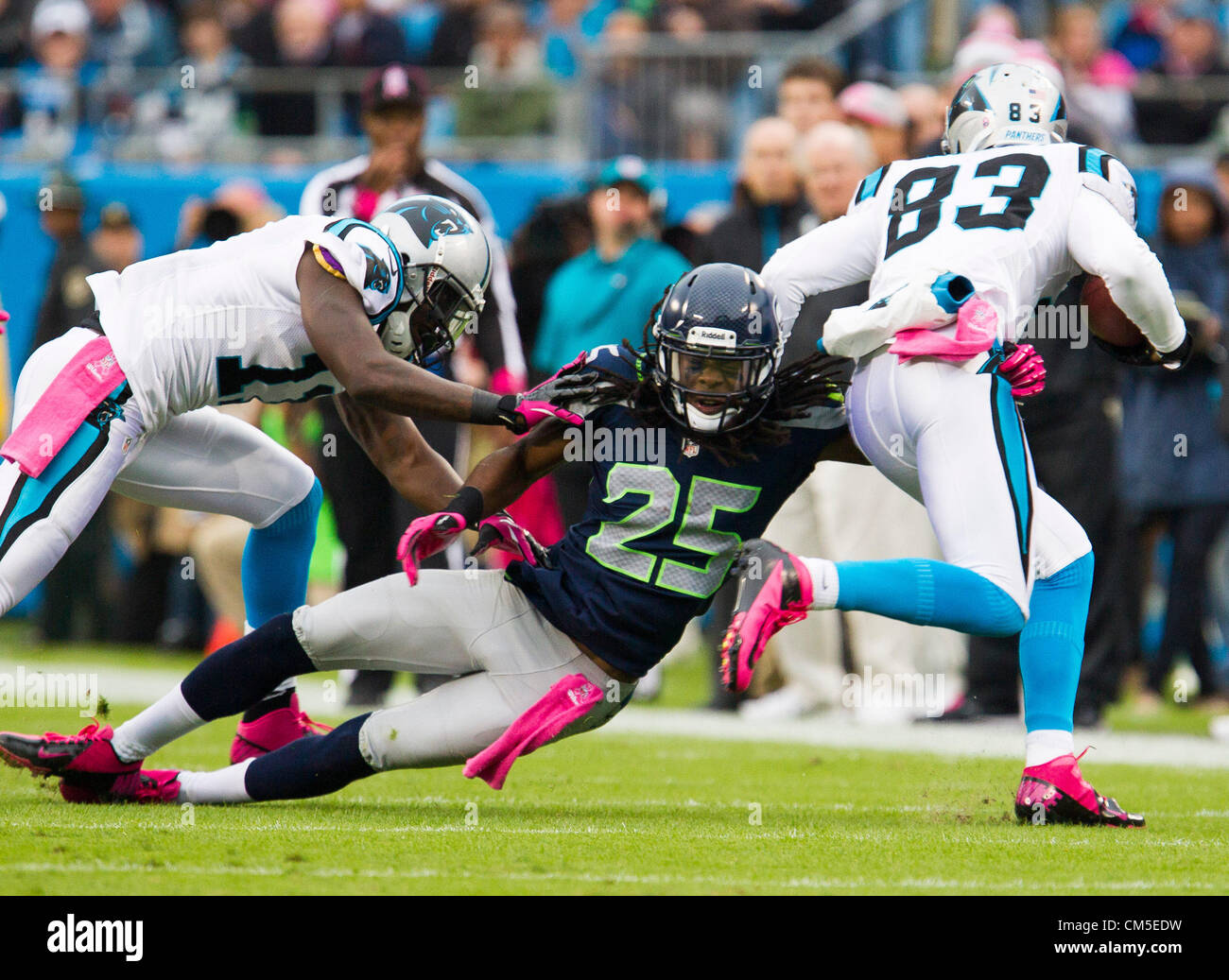Oct. 07, 2012 - Charlotte, North Carolina, U.S. - Seahawks CB RICHARD SHERMAN (25) fighting off a block and making a tackle on Panthers WR LOUIS MURPHY (83) during the Panthers vs. Seahawks game at Bank of America Stadium. (Credit Image: © Anantachai Brown/ZUMAPRESS.com) Stock Photo