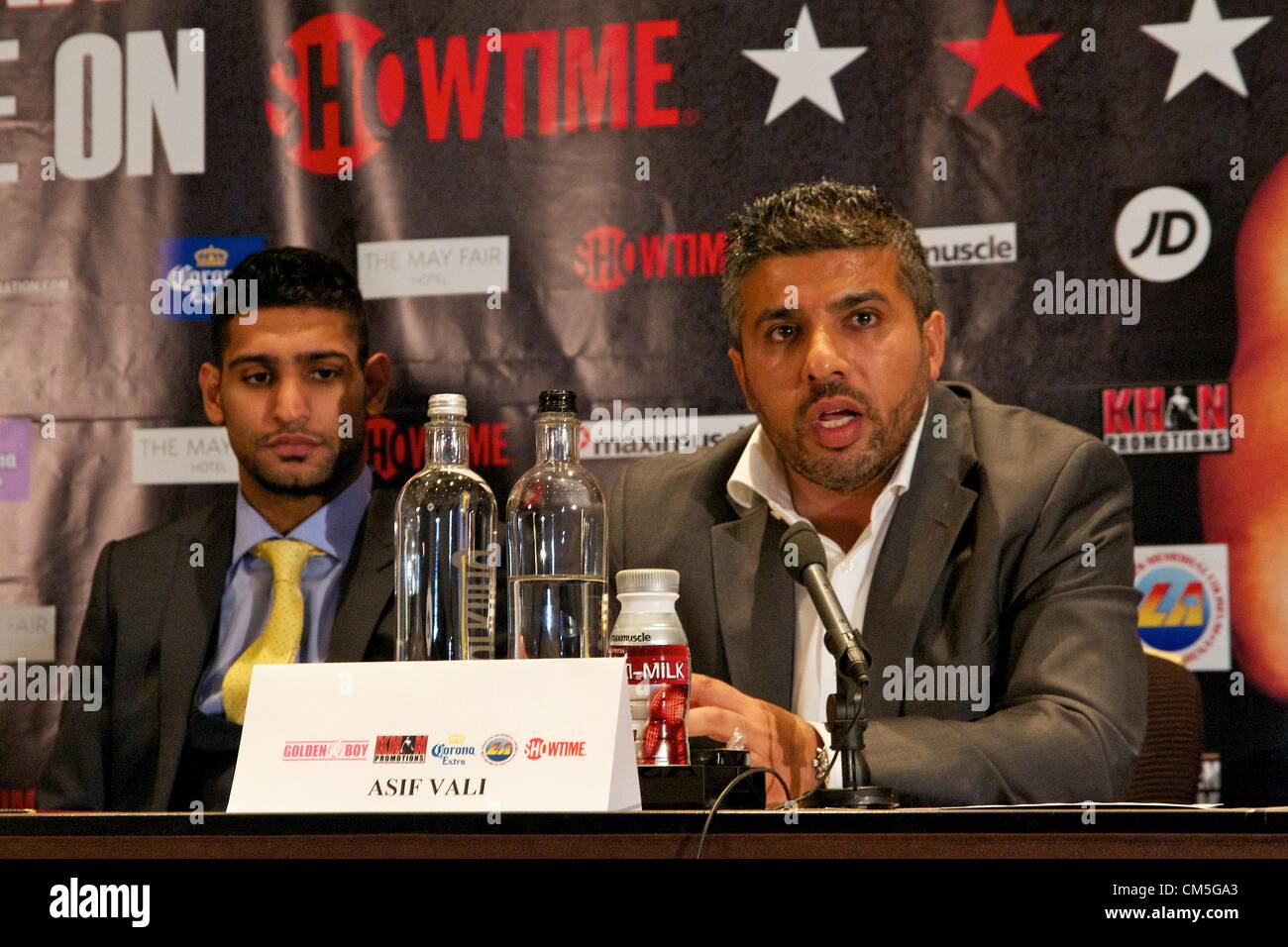 London, UK. 9th October 2012. Boxer Amir Khan with his manager Asif Vali speaking at the Mayfair Hotel in London on Tuesday October 9, 2012 to promote his December 15 bout against Carlos Molina in Los Angeles.  Credit:  Paul McCabe / Alamy Live News Stock Photo