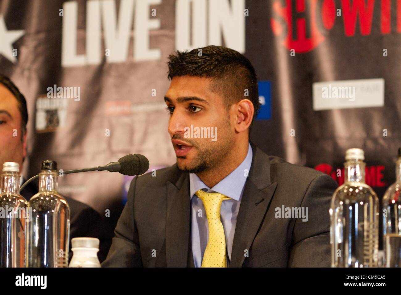 London, UK. 9th October 2012. Boxer Amir Khan speaks at the Mayfair Hotel in London on Tuesday October 9, 2012 to promote his December 15 bout against Carlos Molina in Los Angeles.  Credit:  Paul McCabe / Alamy Live News Stock Photo