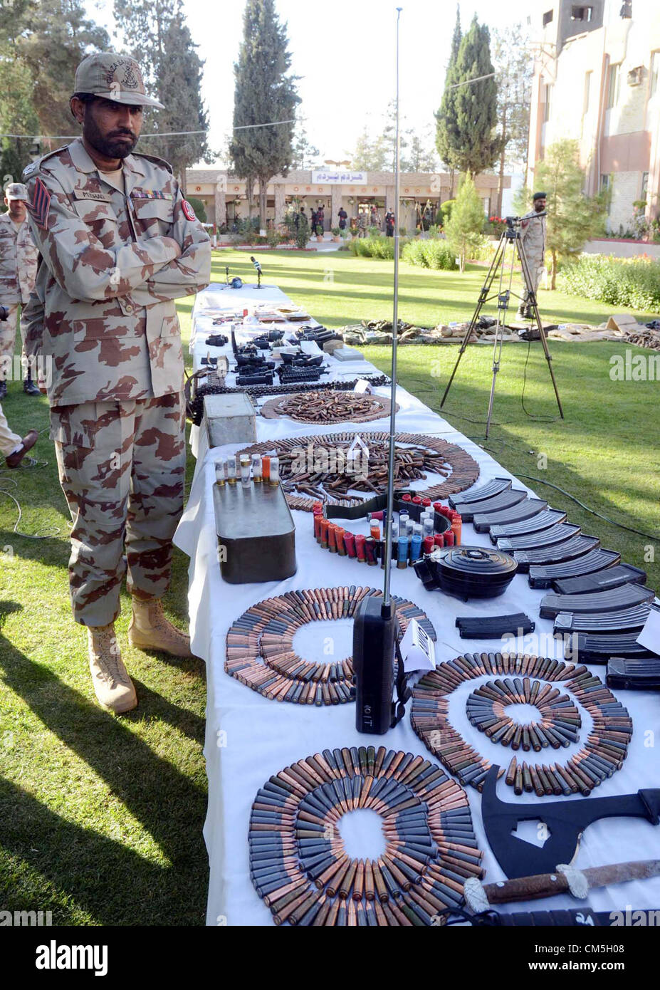 Frontier Corps officials show seized weapons, bullets and fake vehicles ...