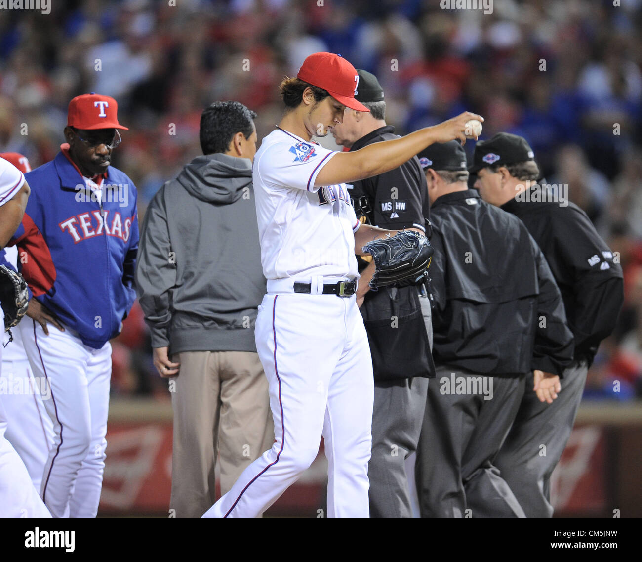 (C-L) Yu Darvish, Joe Furukawa, Ron Washington manager (Rangers), OCTOBER 5, 2012 - MLB : Yu Darvish of the Texas Rangers stretches his shoulder in the sixth inning during the American League Wild Card Playoff game against the Baltimore Orioles at Rangers Ballpark in Arlington in Arlington, Texas, United States. (Photo by AFLO) Stock Photo