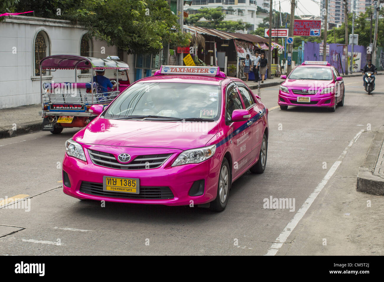 Oct. 11, 2012 - Bangkok, Thailand - Toyota Corollas in use as taxicabs on the street in Bangkok, Thailand. The Toyota Corolla is the backbone of the Thai taxi fleet. About 160,000 units of Toyota's popular Camry and Corolla models produced between March 21, 2006 and May 31, 2010 in Thailand are part of Toyota Motor's global recall. Toyota Motor Corp said yesterday it would recall more than 7.4 million vehicles worldwide because the faulty power window switch was a potential fire hazard, the latest in a series of setbacks that have dented the reputation of Japan's biggest automaker. The volunta Stock Photo