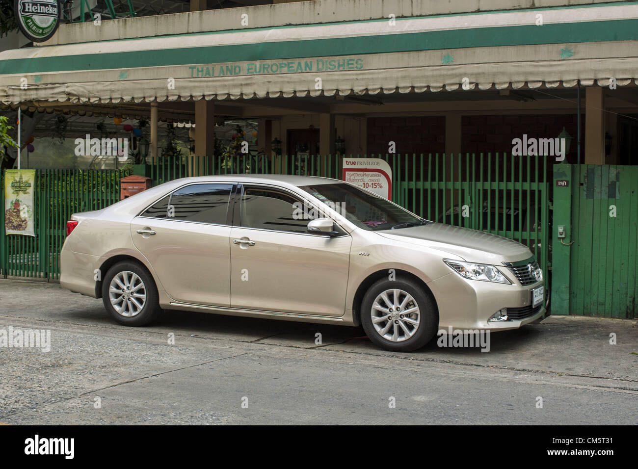 Oct. 11, 2012 - Bangkok, Thailand - A Toyota Camry parked on a street in Bangkok, Thailand. About 160,000 units of Toyota's popular Camry and Corolla models produced between March 21, 2006 and May 31, 2010 in Thailand are part of Toyota Motor's global recall. Toyota Motor Corp said yesterday it would recall more than 7.4 million vehicles worldwide because the faulty power window switch was a potential fire hazard, the latest in a series of setbacks that have dented the reputation of Japan's biggest automaker. The voluntary move is the biggest single recall since Ford pulled 8 million vehicles  Stock Photo