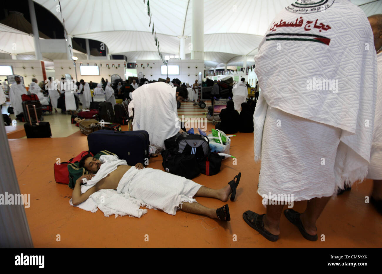 Oct. 11, 2012 - Jeddah, Jeddah, Saudi Arabia - Palestinian Muslim pilgrims arrive at the King Abdulaziz international airport as they prepare to go for their pilgrimage to Mecca, Oct. 12,2012. The event is held in preparation for carrying out the five pillars of Islam in the Holy Land, when they will make their Hajj to Mecca  (Credit Image: © Momen Faiz/APA Images/ZUMAPRESS.com) Stock Photo