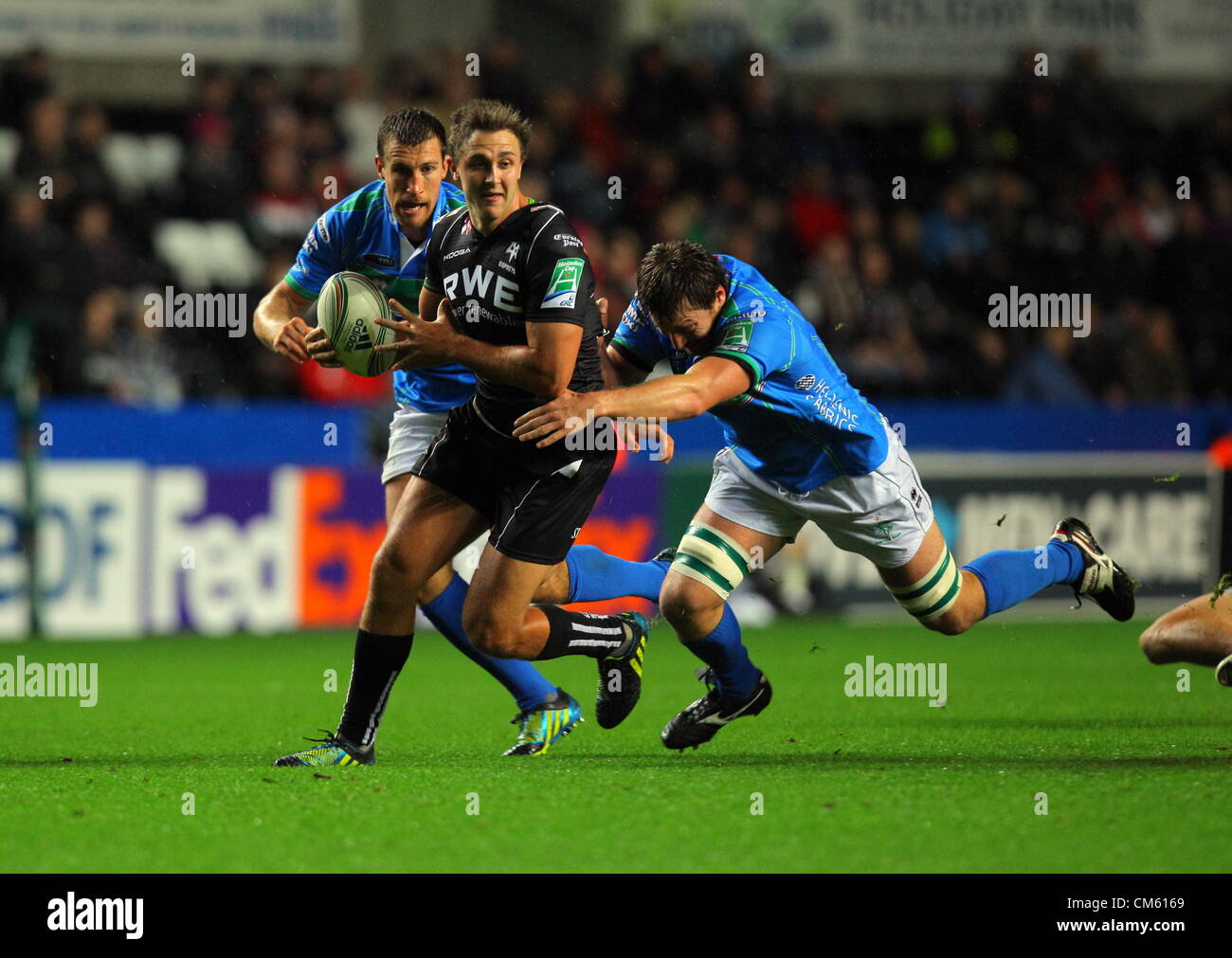 Friday 12 October 2012  Pictured L-R: Ashley Beck of the Ospreys is tackled by Paul Derbyshire of Benetton Treviso.   Re: Heineken Cup, Ospreys v Benetton Treviso at the Liberty Stadium, SWansea, south Wales. Stock Photo