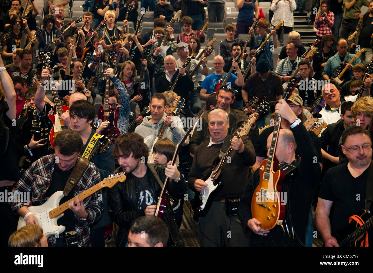 Coventry, UK. 'Strum a Chord for a good cause' event held on Sunday 14th October 2012 at the Ricoh Arena Coventry England UK The event, held in aid of Childline, was an attempt to set a world record for the largest electric guitar ensemble. Stock Photo